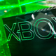 An Xbox sits in a display case.